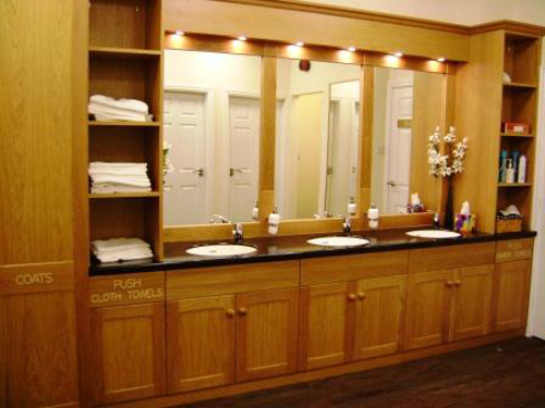 Commercial Bathroom With Oak Units