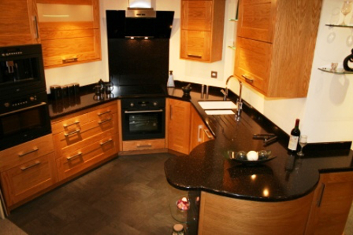 Kitchen With High Gloss Staron Worksurfaces