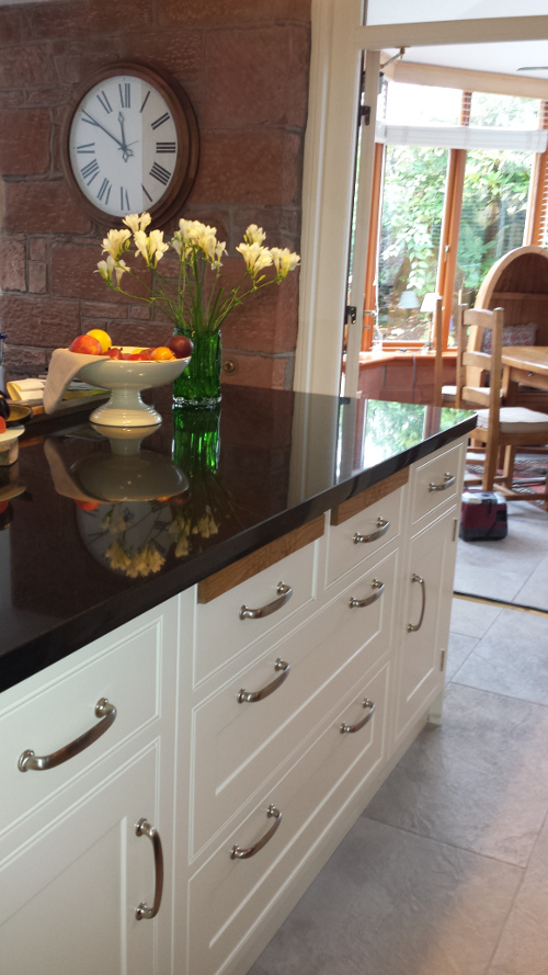 Cream Cupboards With Oak Chopping Boards