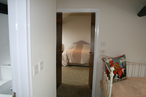 Twin Doors Open To Bedroom